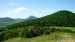 V pozadí za Sutomským vrchem Francká hora, Milešovka a Ostrý